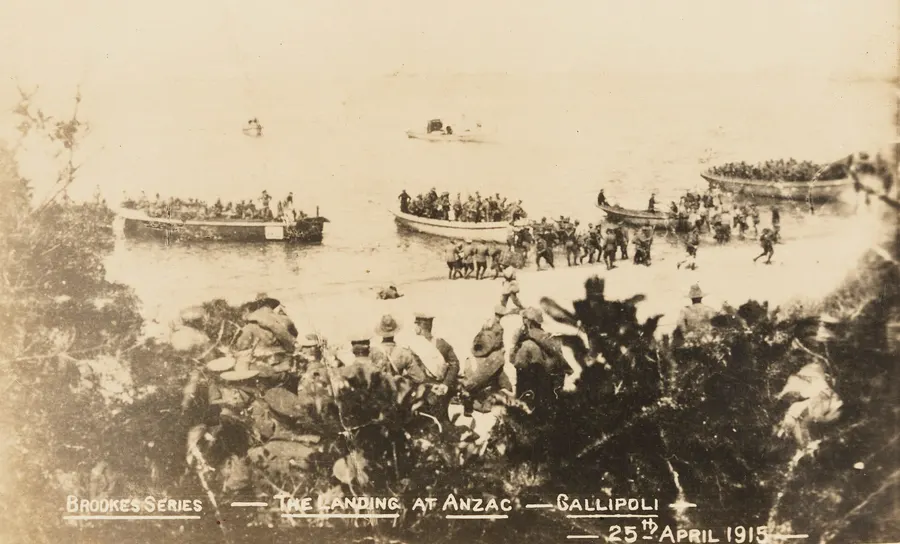 Australian troops landing at Anzac Cove on 25 April 1915, in a postcard published by Brookes (State Library of New South Wales).