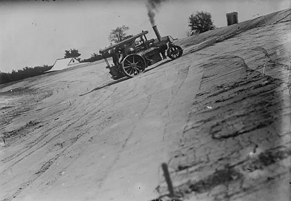 A steam roller on the banked track of the Indianapolis Motor Speedway in its early days