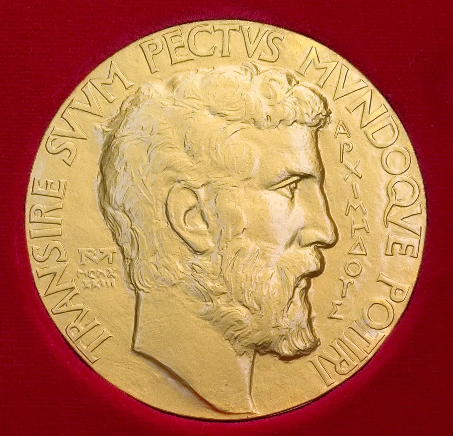 The front of the Fields Medal, showing the Greek mathematician Archimedes
