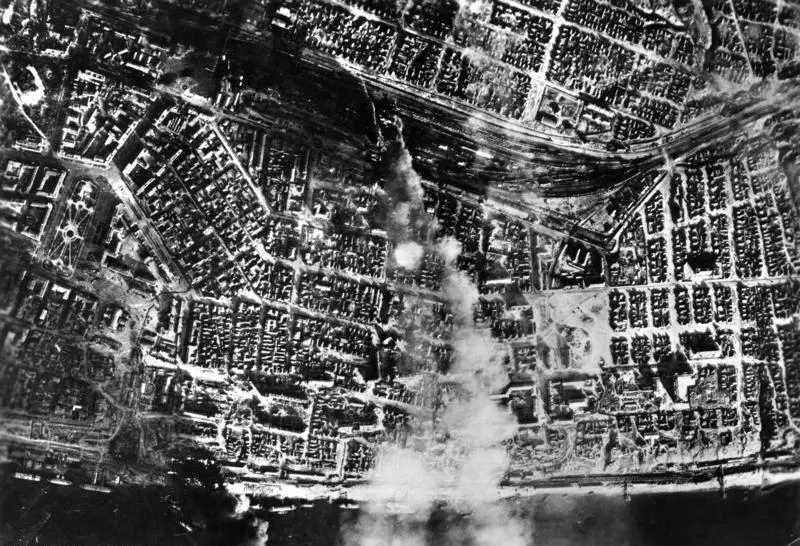 A German aerial photograph of Stalingrad in August 1942, with smoke rising from bomb strikes near a railway station (German Federal Archives)
