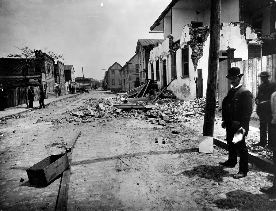A fissure and a wrecked brick house on Tradd Street, Charleston, after the earthquake of 31 August 1886, photographed by John K. Hillers