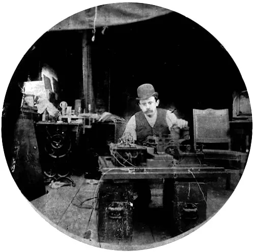 Charles Kayser of Edison's laboratory with an early version of the Kinetograph camera, about 1891
