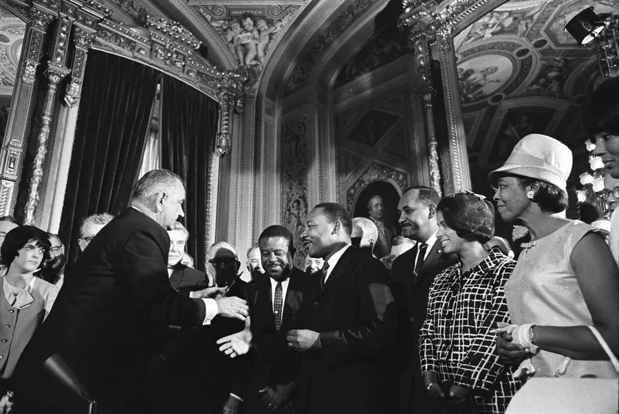 President Lyndon B. Johnson with Martin Luther King Jr. at the signing of the Voting Rights Act, photographed by Yoichi Okamoto