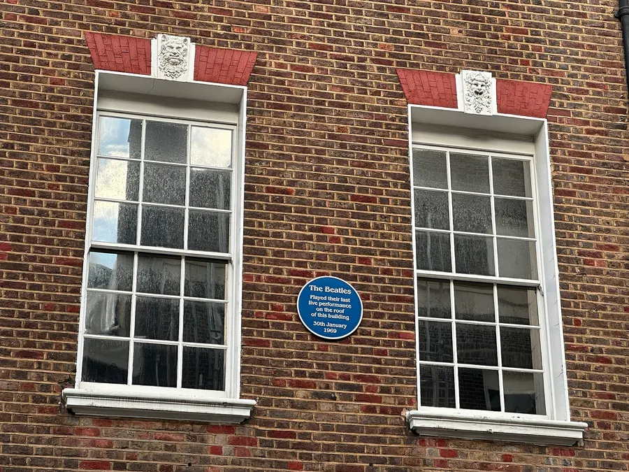 The plaque at 3 Savile Row, London, where the Beatles played on the roof on 30 January 1969.