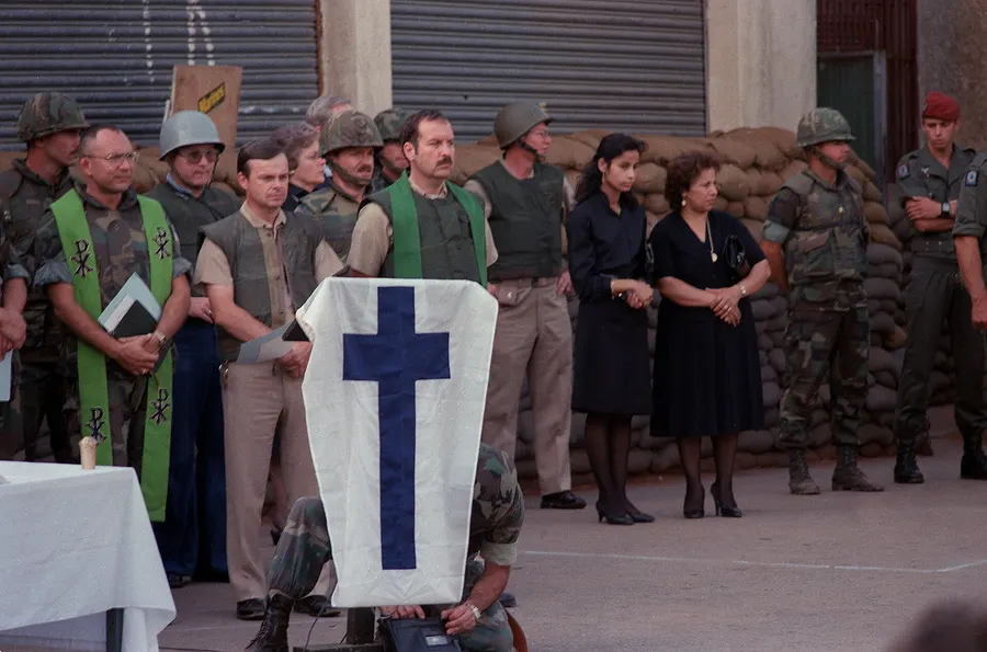 Marines, chaplains and families observe a moment of silence at a memorial service for those killed in Beirut.