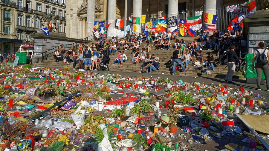Flowers and flags at the memorial on the Place de la Bourse in Brussels, May 2016.