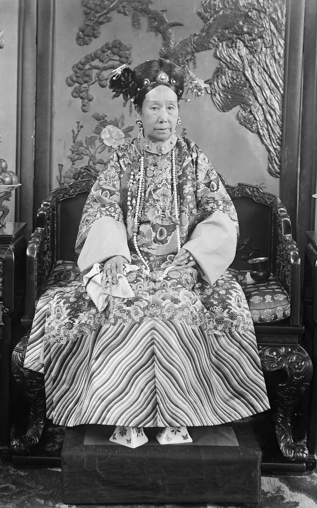 The Empress Dowager Cixi, who dominated the Qing court in 1900, photographed at the palace by the court photographer Yu Xunling