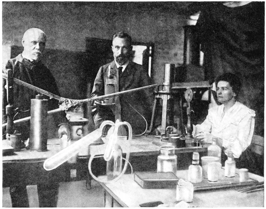 Pierre and Marie Curie in the Paris laboratory where radium was discovered, a photograph published by Marie Curie in 1923.