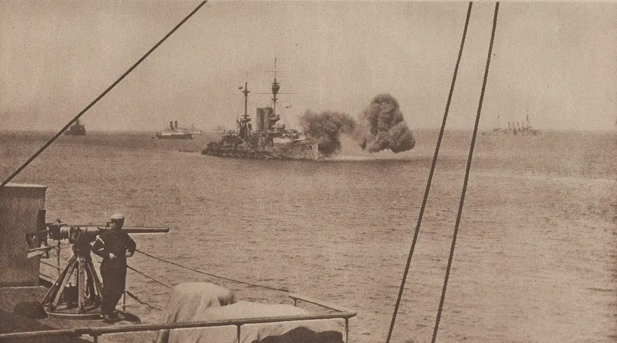HMS Cornwallis, one of the battleships in the opening bombardment, firing on the Gallipoli peninsula later in 1915, seen from a French warship.