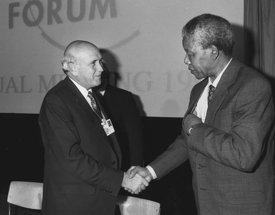 F. W. de Klerk and Nelson Mandela shake hands at the World Economic Forum in Davos, January 1992.
