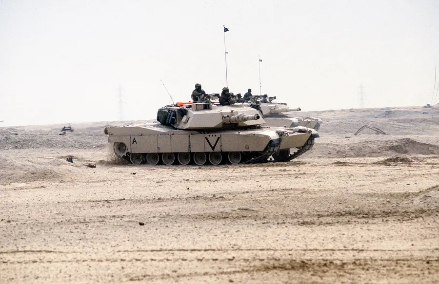 US Marine Corps M1A1 Abrams tanks cross the desert in Kuwait during the ground offensive, dated 24 February 1991.