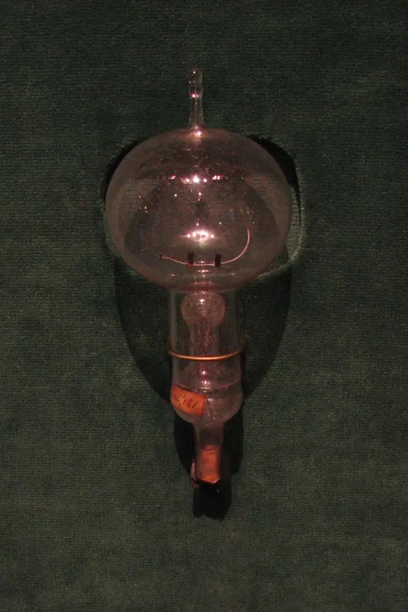 A reproduction of an Edison carbon-filament lamp.