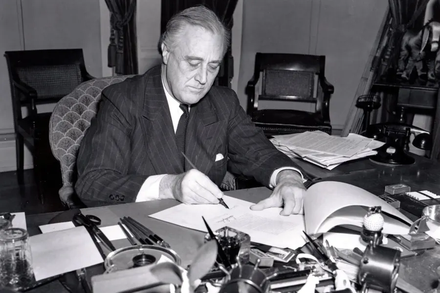 President Roosevelt signing the Lend-Lease bill, 11 March 1941.