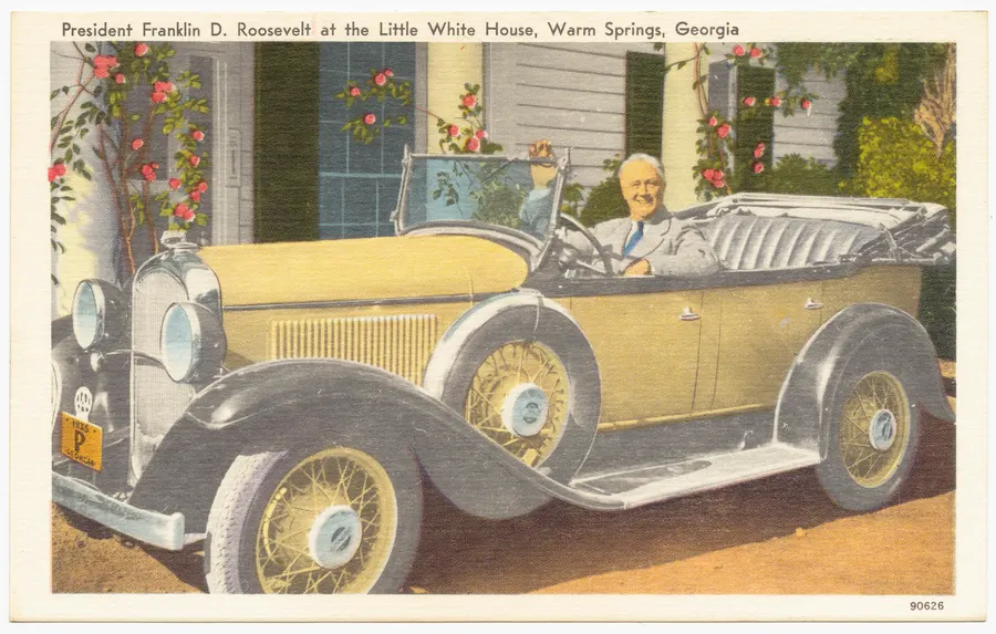 President Roosevelt in his car at the Little White House, Warm Springs, on a postcard of the 1930s or 1940s.