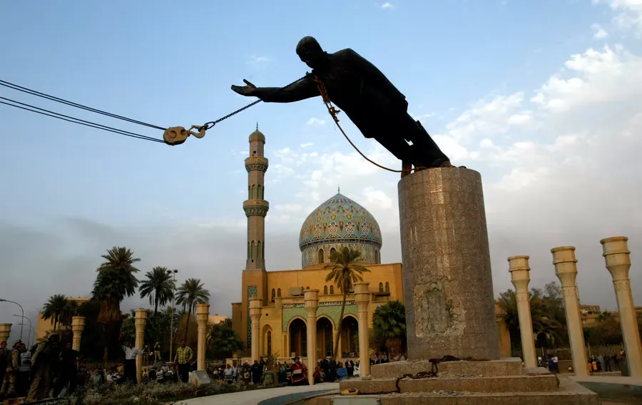 The statue of Saddam Hussein is pulled down in Firdos Square, Baghdad, 9 April 2003.