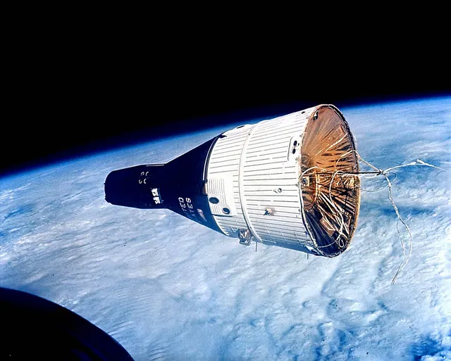 Gemini 7 in orbit, photographed from Gemini 6 during their rendezvous.
