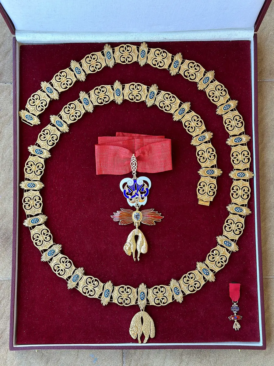 A complete set of the insignia of the Spanish Order of the Golden Fleece: collar, neck badge and miniature.