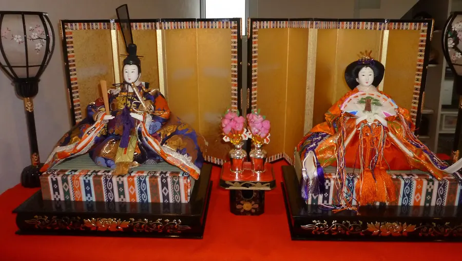 The emperor and empress dolls from the top tier of a hina doll display.