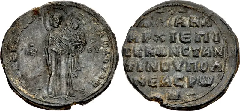 Both sides of a lead seal of Michael Cerularius, Patriarch of Constantinople, with the Virgin on one face and a Greek inscription naming him on the other