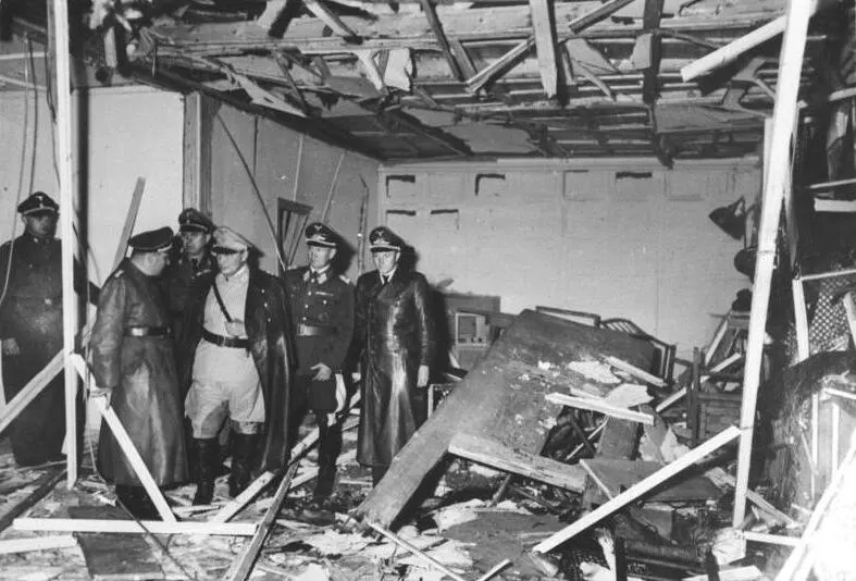 Officers inspect the wrecked briefing hut at Hitler's Wolf's Lair headquarters after the bomb of 20 July 1944