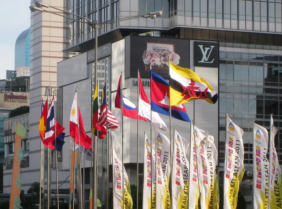 The flags of ASEAN's member states lining a street in Jakarta during a summit in 2011