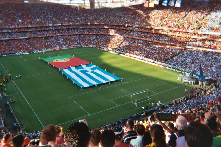 Giant Portuguese and Greek flags laid out on the pitch of the Estádio da Luz in Lisbon for the final