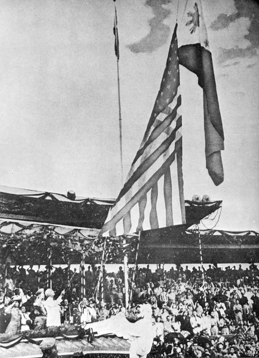The independence ceremony in Manila on 4 July 1946, when the US flag was lowered and the Philippine flag raised
