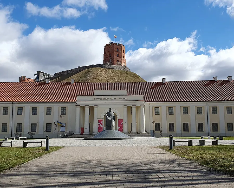 The monument to King Mindaugas outside the National Museum of Lithuania in Vilnius, with Gediminas' Tower on the hill behind