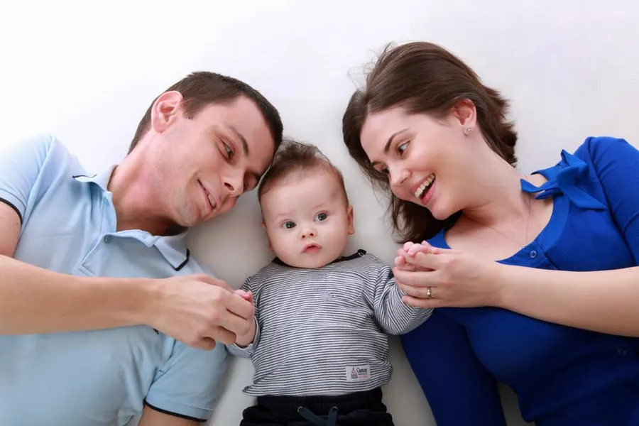 A mother and father with their baby
