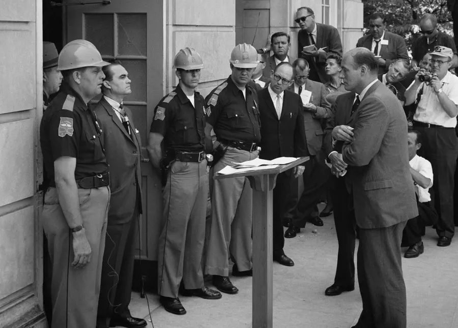 Governor George Wallace stands at the door of Foster Auditorium at the University of Alabama, confronted by Deputy Attorney General Nicholas Katzenbach