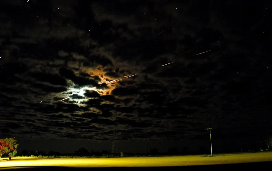 Hayabusa streaking across the night sky over the Woomera range in South Australia as it re-entered on 13 June 2010