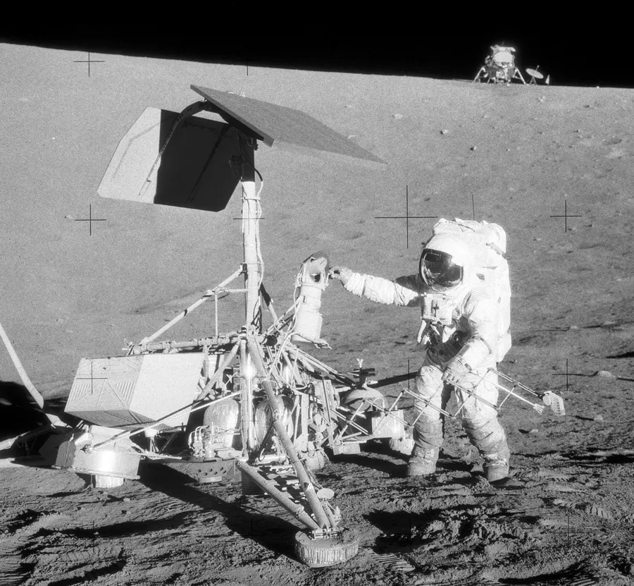 Apollo 12 astronaut Pete Conrad beside Surveyor 3, a sister craft of Surveyor 1, on the Moon in 1969