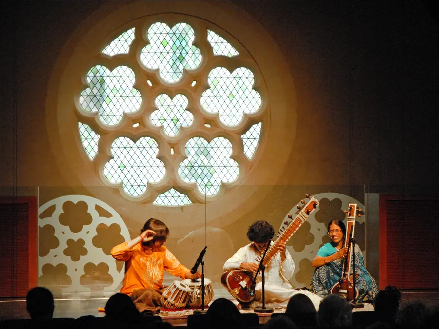 Indrajit Banerjee on sitar, with tabla and tanpura players, giving an evening raga concert at the Collège des Bernardins in Paris on 21 June 2010