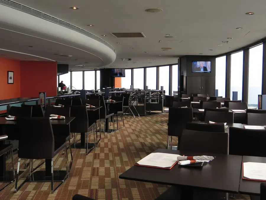 A dining room high up inside the CN Tower, with windows looking out over Toronto