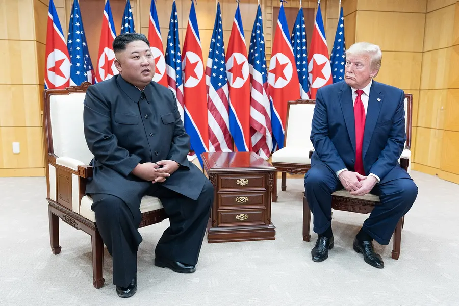 Kim Jong Un and Donald Trump speaking to reporters in the Freedom House at the Demilitarised Zone on 30 June 2019