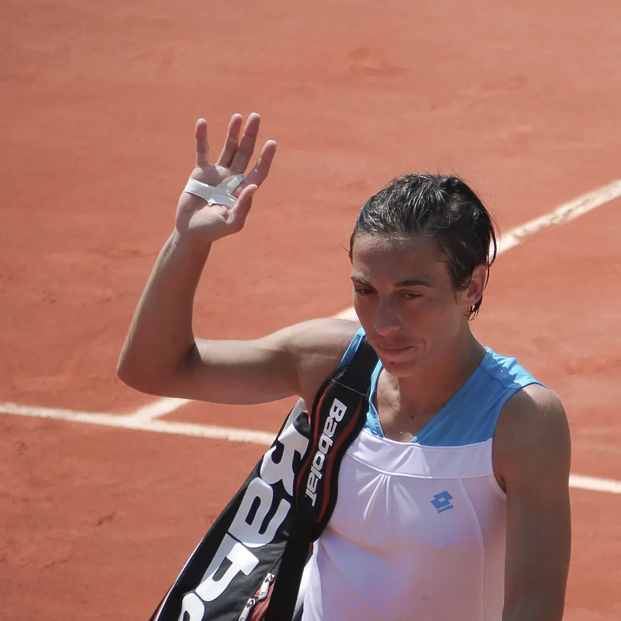 Francesca Schiavone waves to the crowd at Roland-Garros in 2012