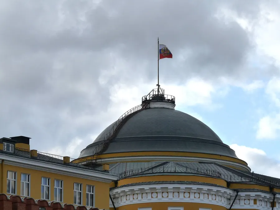 The dome of the Senate building in the Moscow Kremlin, flying the Russian flag.