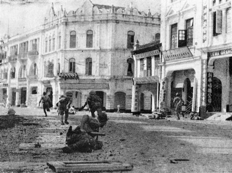 Japanese troops in the streets of Kuala Lumpur during their advance through Malaya, 1942.