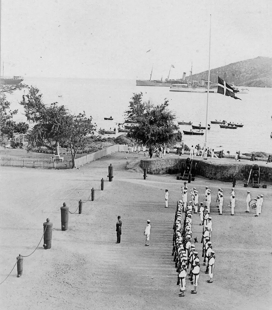 The Danish flag is lowered for the last time at the governor's mansion on St Croix, 31 March 1917.