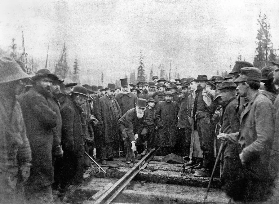 Donald Smith drives the last spike of the Canadian Pacific Railway at Craigellachie, 7 November 1885.