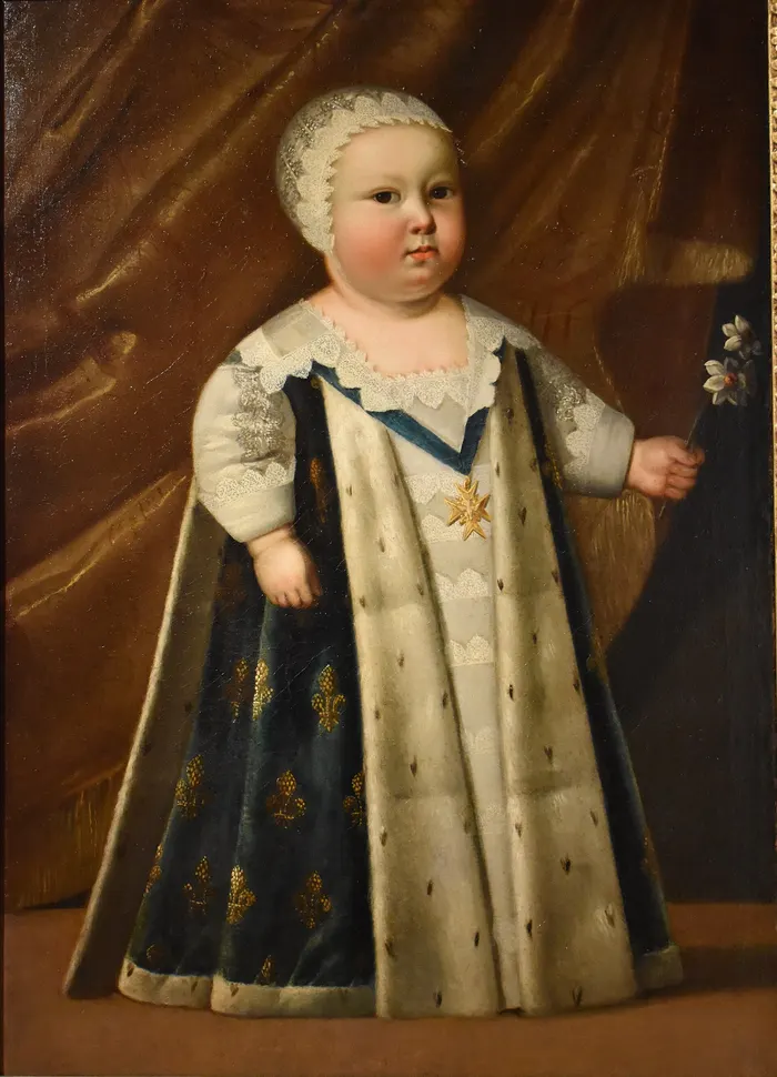 Louis XIV as a small boy, when he was still the dauphin, after a portrait by Henri and Charles Beaubrun.