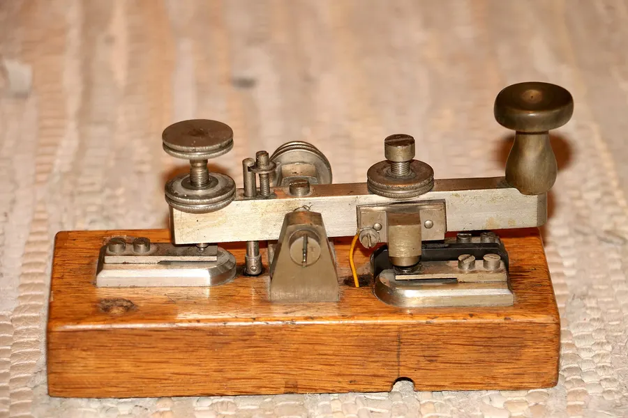 A Morse telegraph key, the kind of instrument used to tap out messages in Morse code