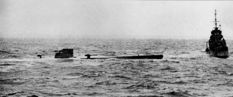 The captured submarine U-110 photographed from HMS Bulldog