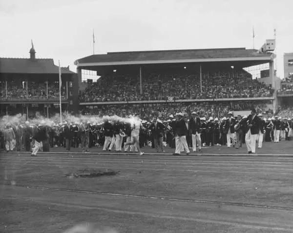 Ron Clarke carries the Olympic torch into the Melbourne Cricket Ground at the opening ceremony, 22 November 1956.