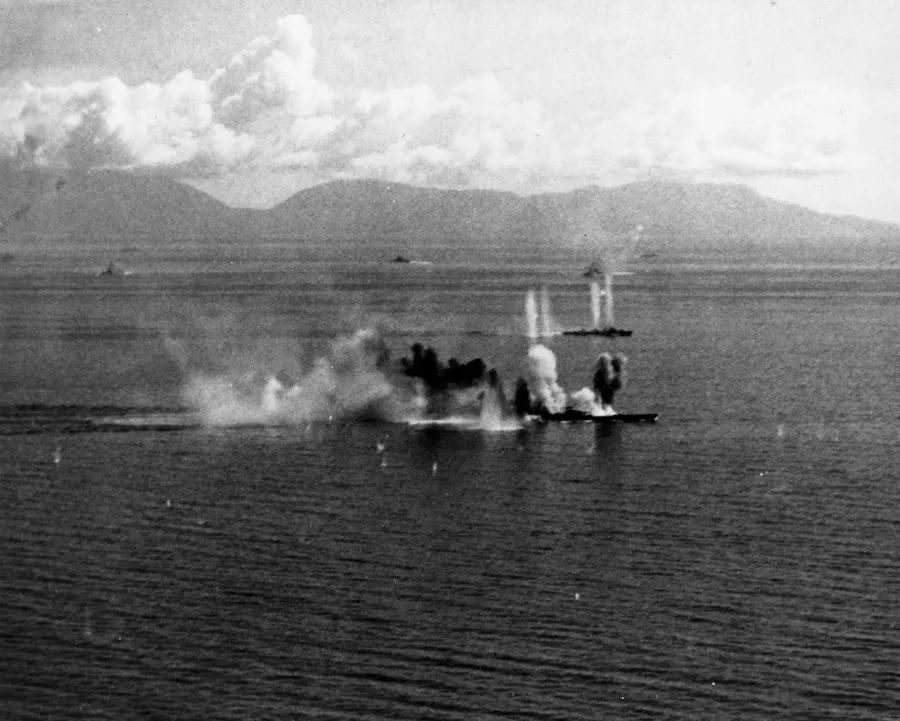 The Japanese battleship Musashi and a destroyer under air attack in the Sibuyan Sea on 24 October 1944, the day after the battle opened.