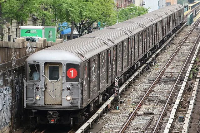 A 1 train leaving the 125th Street station in New York.
