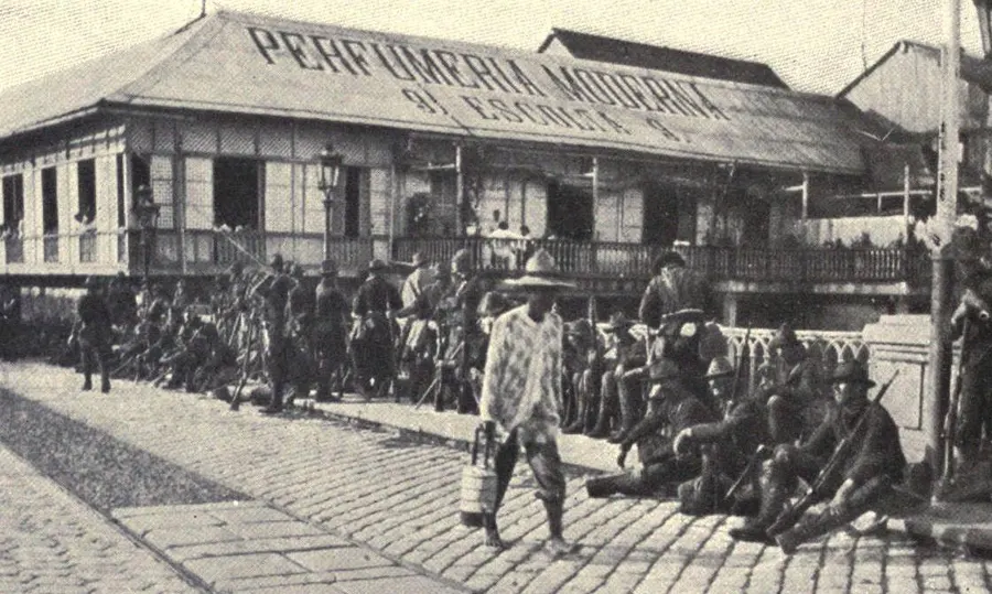 American troops guarding the bridge over the Pasig River in Manila on the afternoon the Spanish surrendered the city, August 1898.