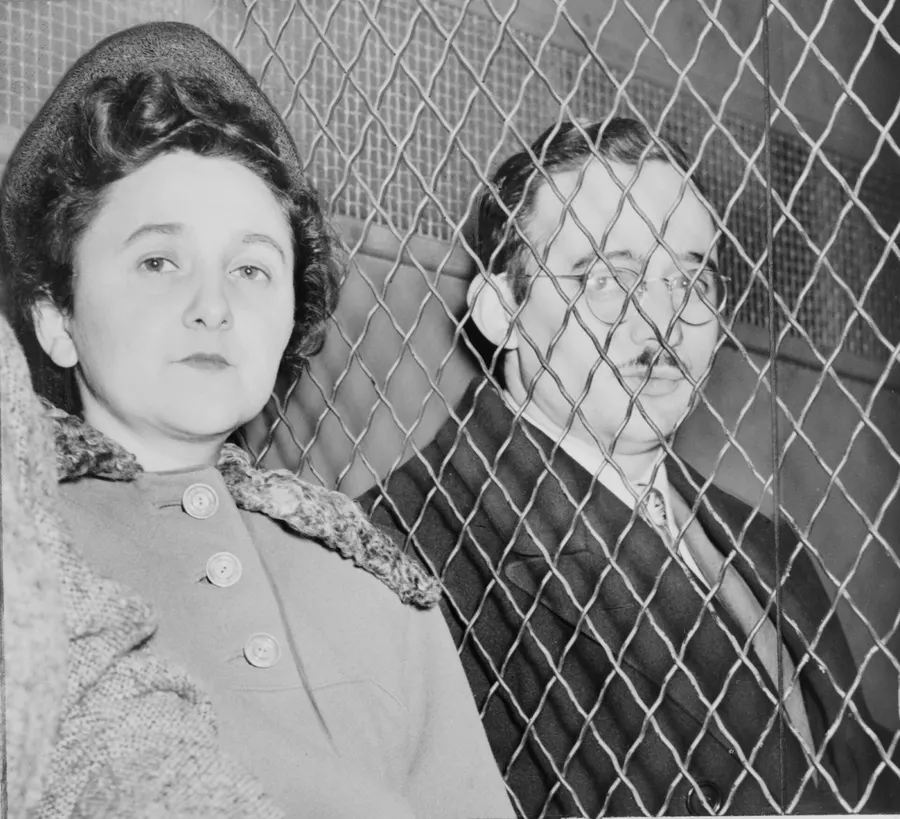 Julius and Ethel Rosenberg, separated by a wire screen, leave the courthouse after the verdict, 1951.