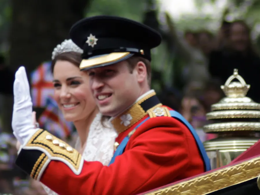 Prince William and Catherine wave from their carriage after the wedding, 29 April 2011.
