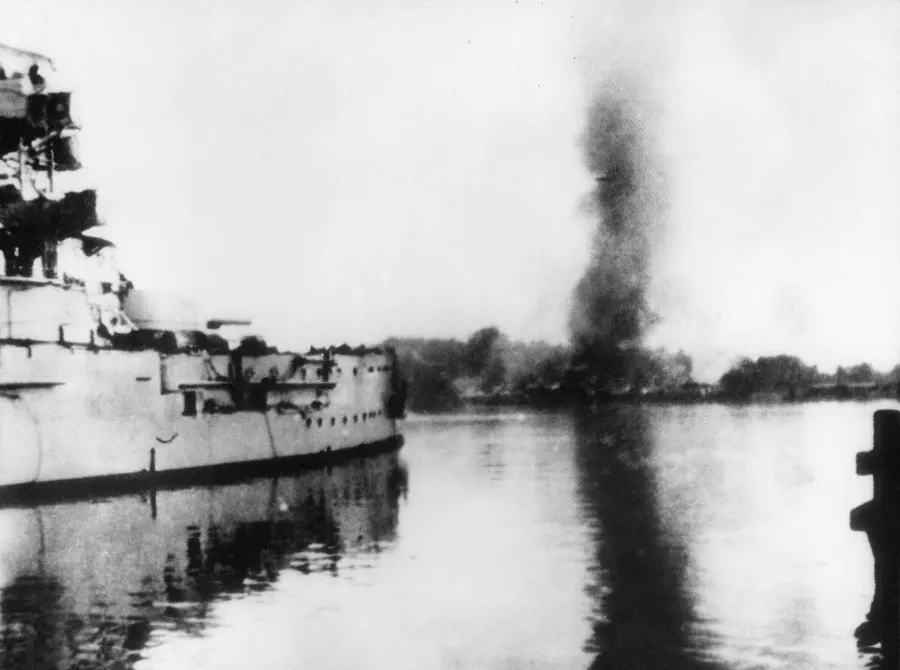 The German battleship Schleswig-Holstein fires on the Polish military depot at Westerplatte, Danzig, at the start of the invasion of Poland in September 1939